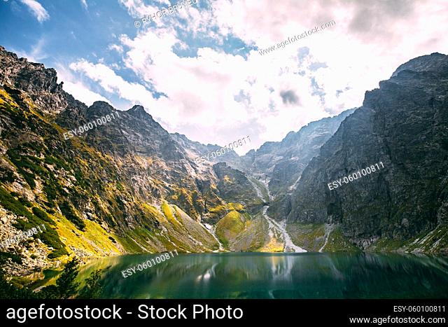 Tatra National Park, Poland. Calm Lake Czarny Staw Under Rysy And Summer Mountains Landscape. Beautiful Scenic View Of Lake