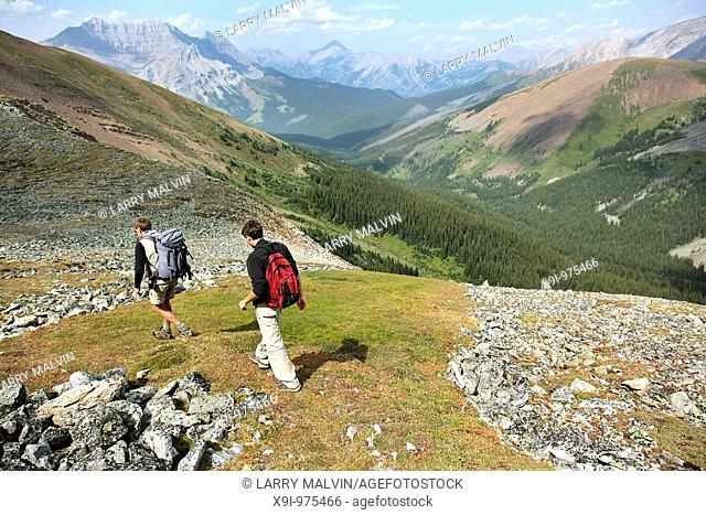 Two men hiking along ridge in Banff National Park, Canada