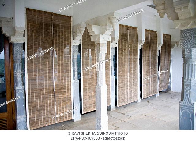 Air ventilation curtain made of bamboos in royal courtyard ; Rich Palace Hotel ;Devigadh palace ; Village Delwada ; Udaipur ; Rajasthan ; India
