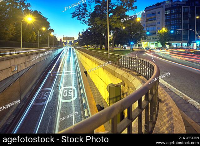 Light trails created by cars entering the tunnel located at Alcala street next to the Retiro Park. Madrid. Spain