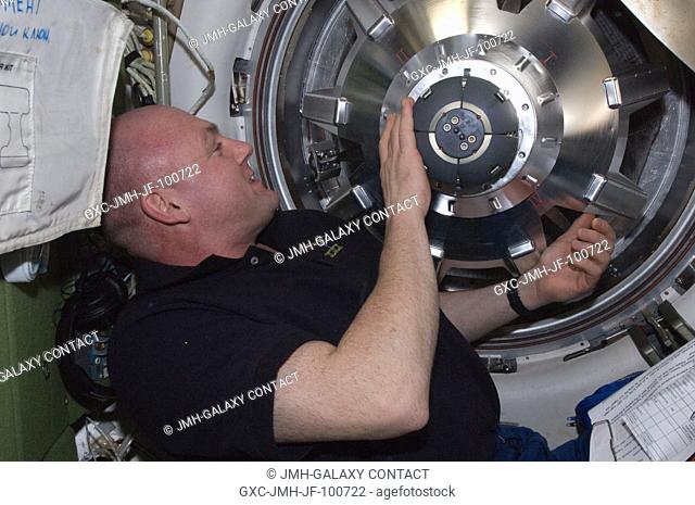 European Space Agency astronaut Andre Kuipers, Expedition 30 flight engineer, prepares to open the hatch in the Zvezda Service Module transfer tunnelATV...