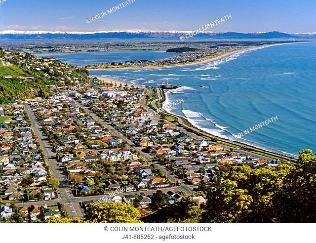 Sumner and Pegasus Bay from Scarborough city and Southern Alps beyond Christchurch New Zealand