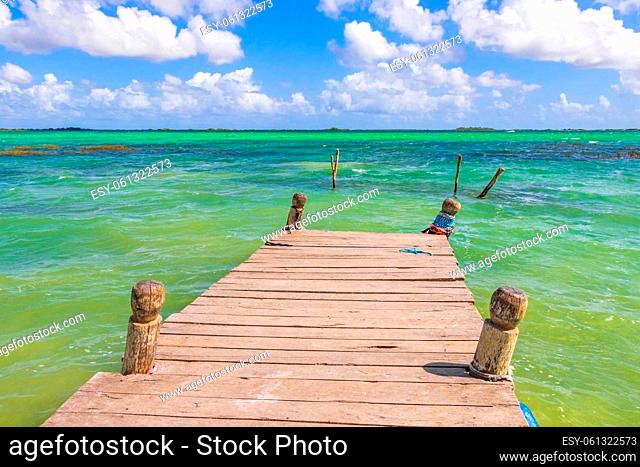 Amazing natural panorama view to the Muyil Lagoon in the tropical jungle nature forest with boats jetty people colorful turquoise water Sian Ka'an National park...