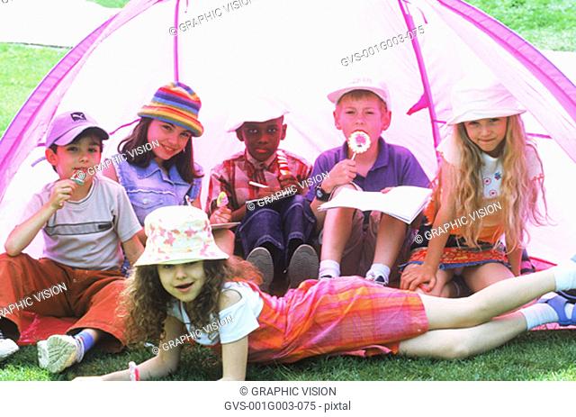 Young children in a tent