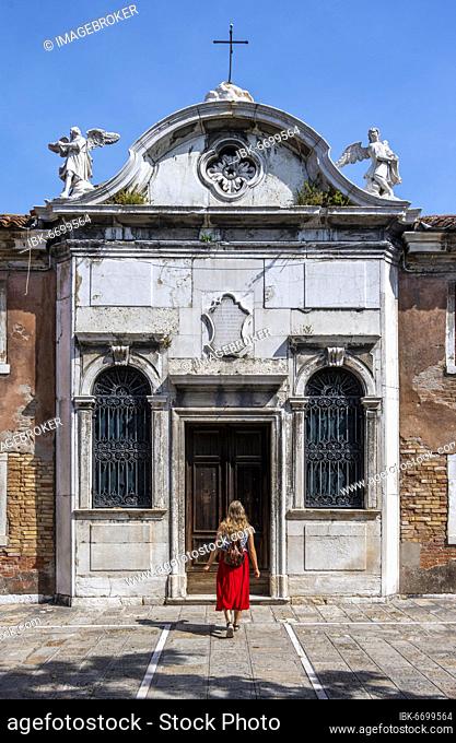 Tourist in red dress in front of a house, Murano, Murano Island, Venice, Veneto, Italy, Europe