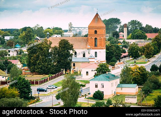 Mir, Belarus. Landscape Of Village Houses And Saint Nicolas Roman Catholic Church In Mir, Belarus. Famous Landmark