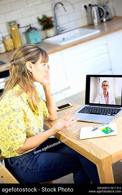 A video consultation between a young woman and her GP