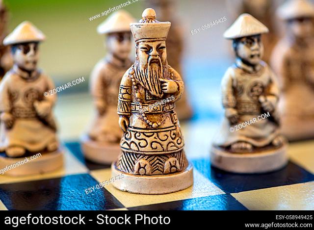 Close-up of a bishop chess piece sitting on a chessboard