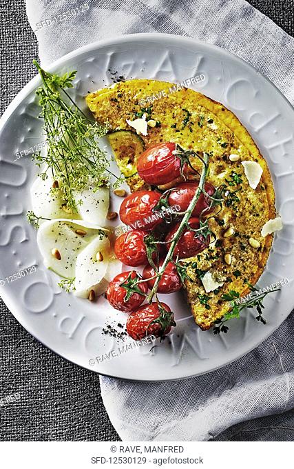 Courgette omlette with herbs, tomatoes, kohlrabi carpaccio and dill flowers