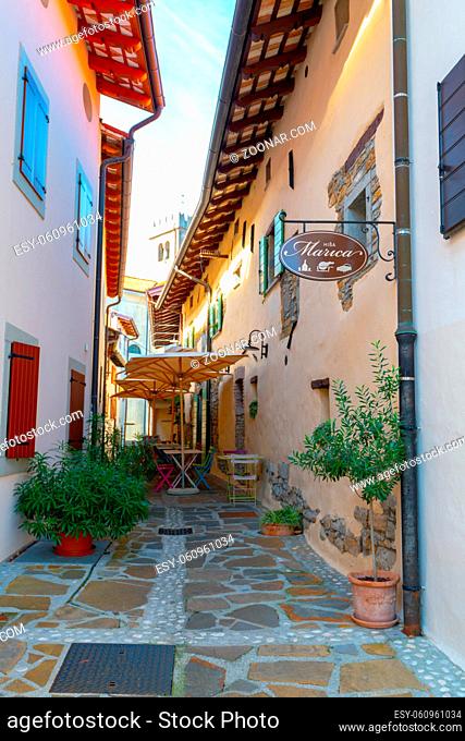 Smartno, Slovenia - Aug 15 2018: Hisa Marica in Smartno, Slovenia is a restaurant and boutique hotel in narrow street in a medieval town with colorful tables...