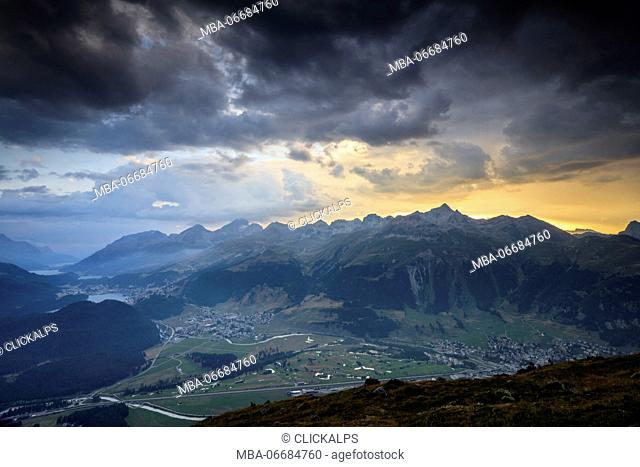 Sunset sky and dark clouds on the rocky peaks of Muottas Muragl St.Moritz Engadine Canton of Graubünden Switzerland Europe