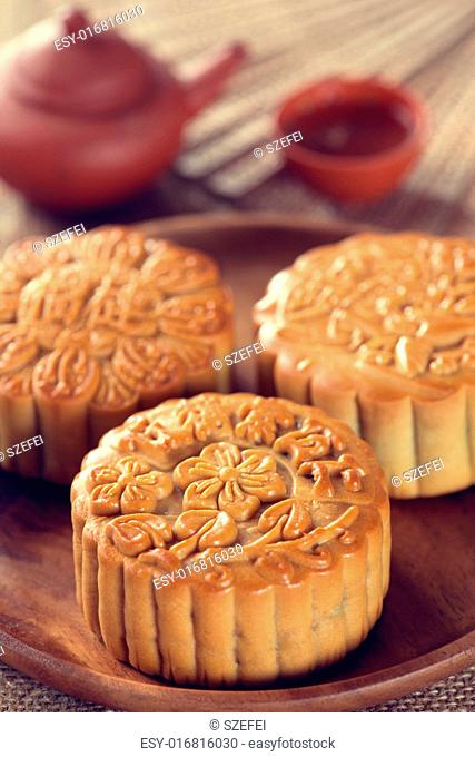 Retro vintage style Chinese mid autumn festival foods. The Chinese words on the mooncakes means assorted fruits nuts, not a logo or trademark