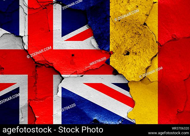 flags of UK and Romania painted on cracked wall