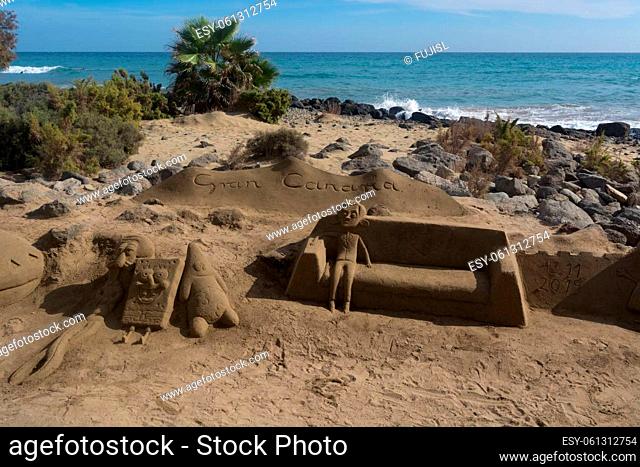 CRAN CANARIA, MELONERAS - 13. NOVEMBER 2019:.Sand sculptures on the beach of Meloneras, Spain with inscription Gran Canaria