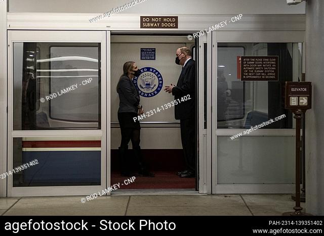 United States Senator Richard Shelby (Republican of Alabama), right, talks with a staffer as he boards the Senate subway following a Senate procedural vote to...