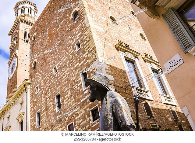 The poet, sculpture of Berto Barbarani, looks at the Lamberti Tower. Piazza delle Erbe. Verona, Veneto, Italy, Europe