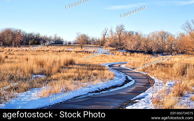 bike trail in fall or winter scenery - one of numerous bike trails in Fort Collins, northern Colorado, recreation and commuting concept