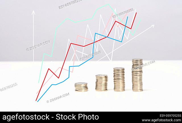 Coin stack step up graph with arrows. Risk management business financial and investment, white table
