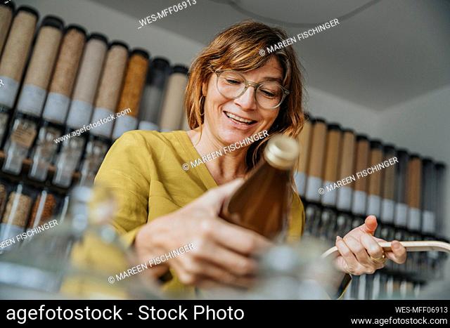 Happy mature customer shopping in retail store
