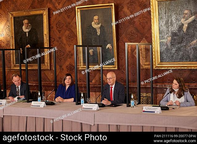 16 November 2021, Hamburg: Peter Tschentscher (2nd from right, SPD), First Mayor of Hamburg, speaks during a state press conference after a Senate meeting on...
