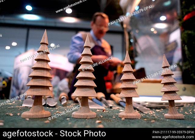 17 November 2021, Saxony, Leipzig: Turned Christmas decorations at the stand for the Ore Mountains at the ""Touristik & Caravaning"" trade fair
