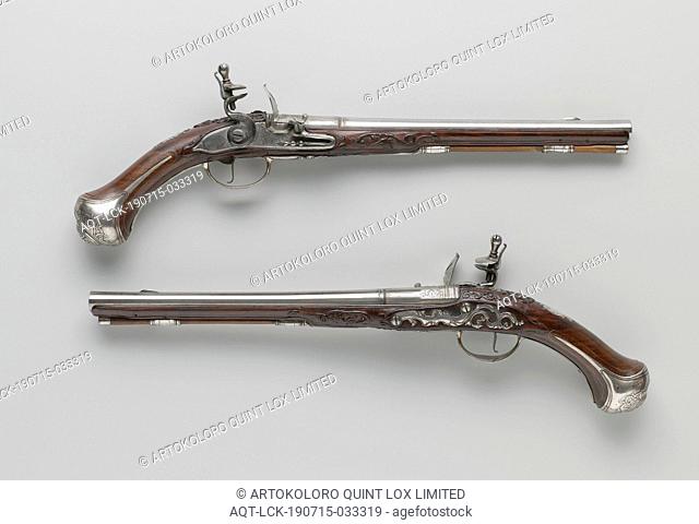 Flint gun, Part of a couple. The lock plate is engraved with a shooting scene and a man with a banner (the images on the two pistols differ slightly from each...