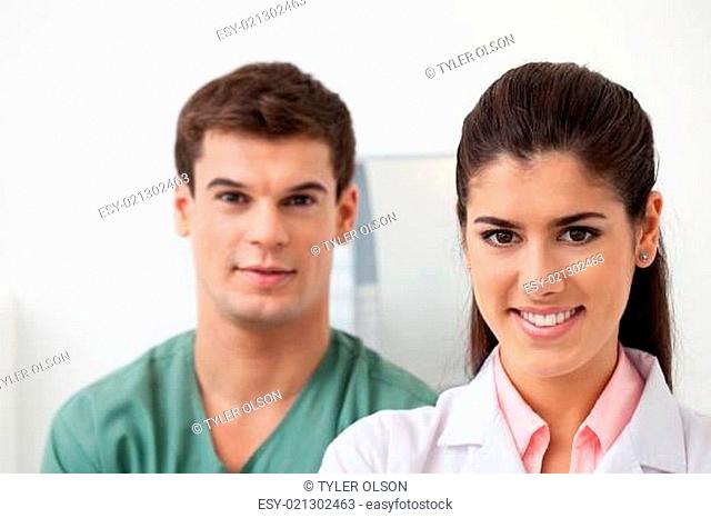 Female doctor with colleague standing behind