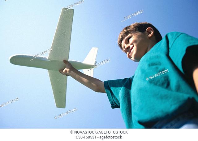 Boy with toy airplane