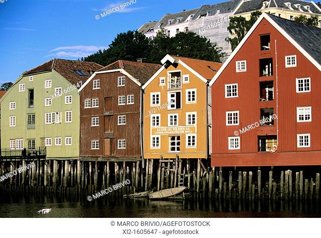 Warehouses in a row on waterfront of river Nidelva, Trondheim, Norway