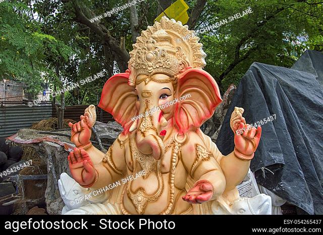 Statue of Hindu God Ganesha. close up of Ganesha Idol at an artist's workshop during Ganesha Festival