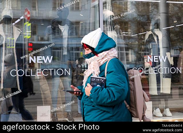 RUSSIA, NOVOSIBIRSK - OCTOBER 27, 2023: A woman walks past a shopfront. A group of State Duma members led by Culture Committee Chairperson Yelena Yampolskaya...