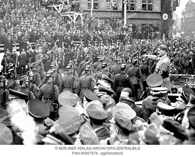 View of a parade for Adolf Hitler (m) on the occasion of the handover of the Saar territory to the German Reich by the League of Nations, in Saarbrücken