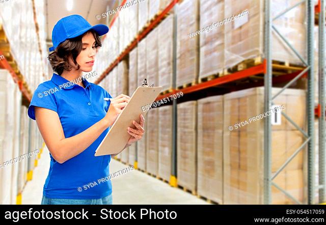delivery girl with clipboard at warehouse