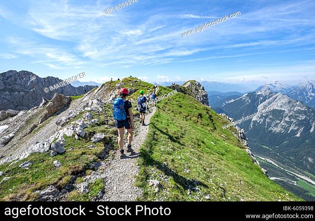 Mountaineers hiking on a ridge, fixed rope route Mittenwalder Höhenweg, Karwendel Mountains, Mittenwald, Bavaria, Germany, Europe