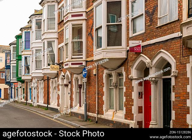 Weymouth, Dorset, England, UK - April 28, 2017: Houses near the city centre on a cloudy day