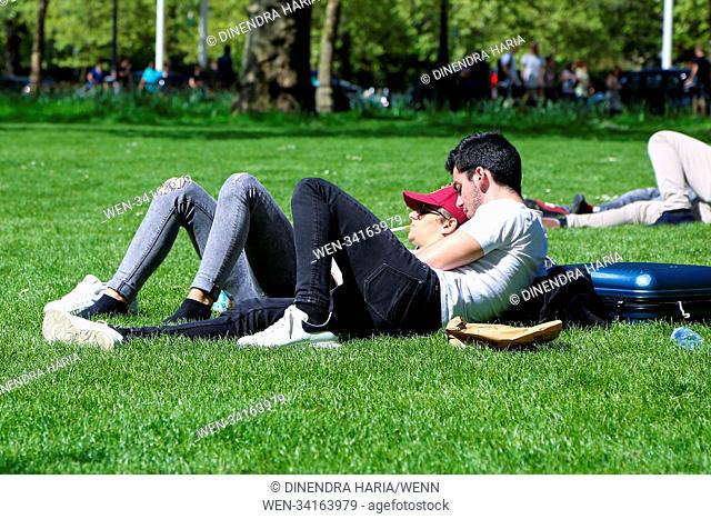 Hot weather continues in the capital. Tourists and Londoners enjoy the hot weather in St James’s Park as temperatures reach 21 degrees celsius in London
