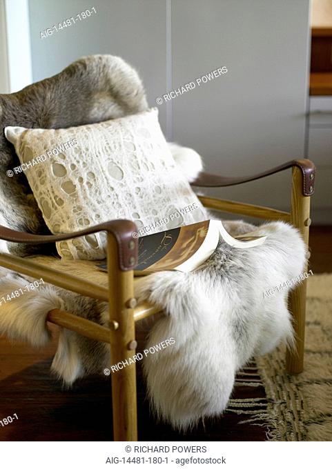 Fur throw on wooden chair, Australia
