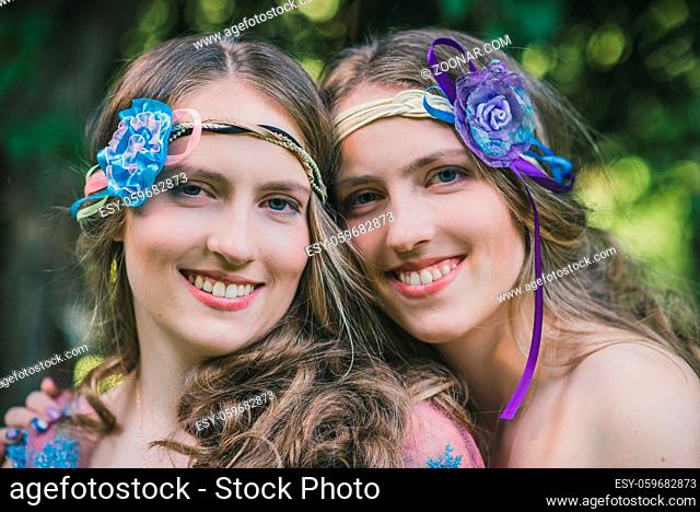 Portrait of two sisters of twins in summer