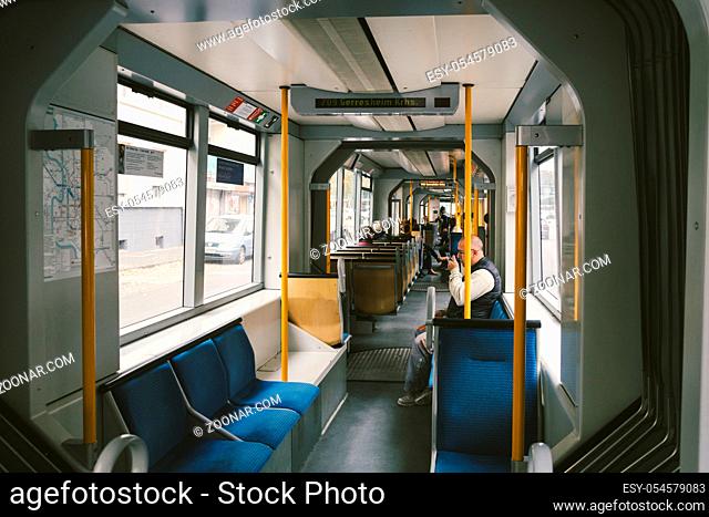 high-speed tram on the city street. Modern Tram In Dusseldorf, Germany October 20, 2018. Tram inside view, passenger compartment with passengers during a ride...