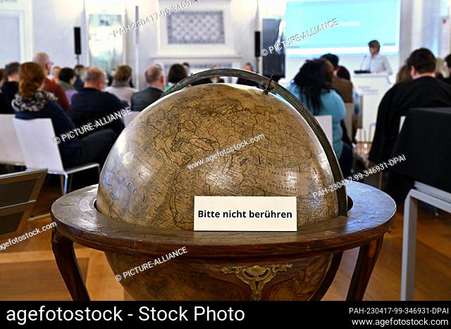 17 April 2023, Thuringia, Gotha: An earth globe by Anders Akerman from Sweden dating from 1766 stands in the Hall of Mirrors of the Research Library during the...