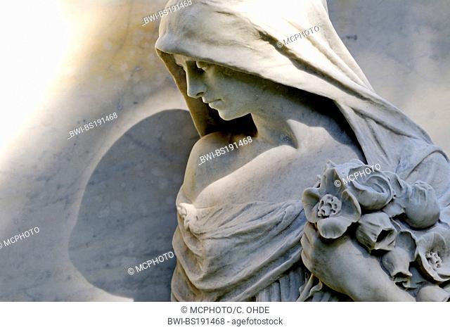 sculpture of a sad young woman at a cemetery