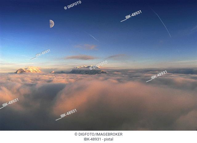 Kaisergebirge and moon above the mist, Tyrol, Austria