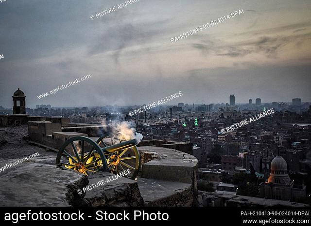 13 April 2021, Egypt, Cairo: Ramadan cannon is fired at sunset to signal the end of the first fasting day of the Muslim holy fasting month of Ramadan
