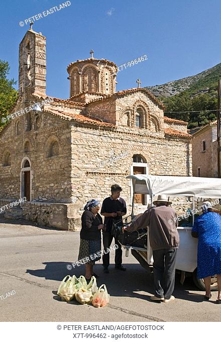 Buying vegetables from a pickup van by the Byzantine church of Agios Sotiris, in the Outer Mani village of Langada, in the the foothills of the Taygetos...