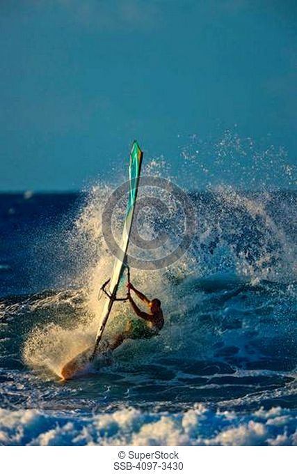 Man windsurfing in the ocean, Maui, Hawaii, USA