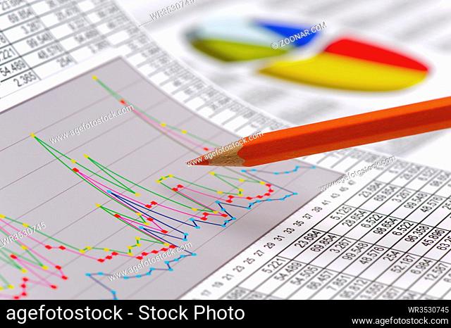 financial chart of stock market with pencil