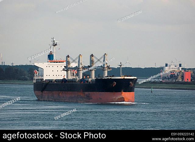 Industrial cargo ship sailing out at sea