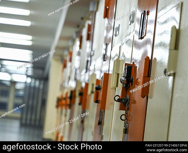 07 December 2023, Berlin: Cell doors are seen in the access department at Moabit prison during the presentation of plans for a suicide prevention room