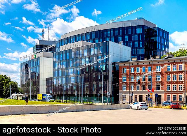 Gdansk, Pomerania / Poland - 2020/07/14: Solidarnosci square with surrounding office buildings and tenement houses in old Gdansk Shipyard quarter in front of...