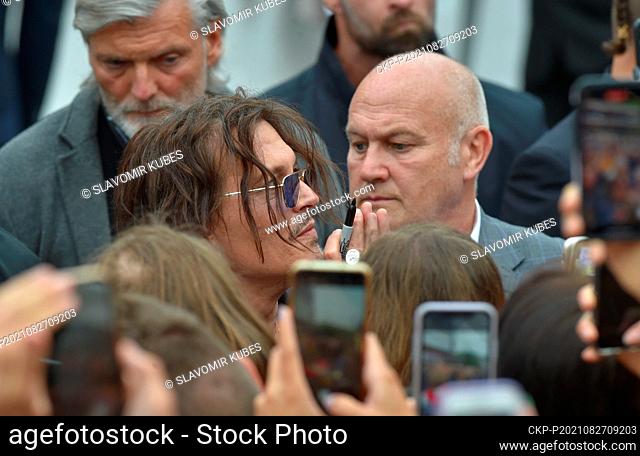 Viewers greet U.S. actor Johnny Depp (centre) after projection at 55th Karlovy Vary International Film Festival (KVIFF), on August 27, 2021, in Karlovy Vary